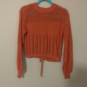 A coral colored American Eagle sweater